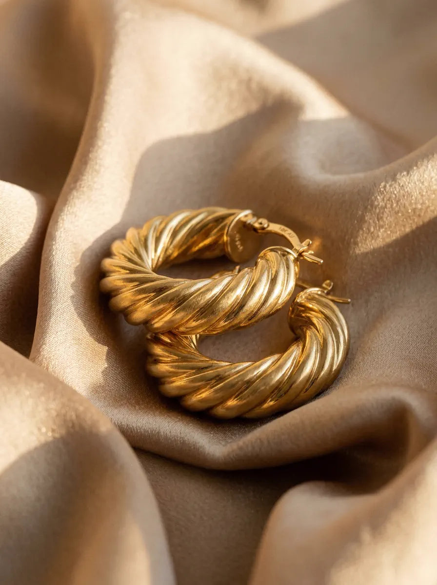 Avirena ribbed gold hoop earrings on satin